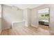 Bedroom with hardwood floors and a view of the backyard at 3661 Annlin Ave, Charlotte, NC 28209