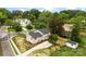 Inviting two-story white home featuring a spacious backyard and charming landscaping at 3661 Annlin Ave, Charlotte, NC 28209
