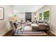 Inviting living room featuring a cozy fireplace, stylish furniture, and ample natural light at 3661 Annlin Ave, Charlotte, NC 28209