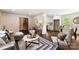 Open-concept living space with hardwood floors, flowing into the kitchen and dining areas at 3661 Annlin Ave, Charlotte, NC 28209