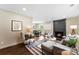 Bright, open-concept living area with fireplace, dining space, and modern decor at 3661 Annlin Ave, Charlotte, NC 28209