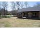 Wide angle view of back of the house with green grass, trees and shrubs at 4531 Dry Run Rd, Fort Mill, SC 29708