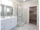 Bathroom featuring double vanity, glass shower, and walk-in closet at 4531 Dry Run Rd, Fort Mill, SC 29708