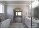 Bathroom features a double vanity, soaking tub, and an archway into the living room at 4531 Dry Run Rd, Fort Mill, SC 29708