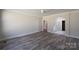 Empty bedroom has stylish floors and an archway leading to the bathroom at 4531 Dry Run Rd, Fort Mill, SC 29708
