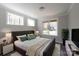 Bedroom with three windows, cozy rug, and nightstands at 4531 Dry Run Rd, Fort Mill, SC 29708
