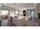 Bright living room features modern furnishings, fireplace, and an open floor plan at 4531 Dry Run Rd, Fort Mill, SC 29708