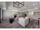 Inviting living area blending with a modern kitchen, featuring comfortable seating and natural light at 4531 Dry Run Rd, Fort Mill, SC 29708
