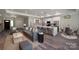 Open-concept living space featuring kitchen island, comfortable seating, and stylish decor at 4531 Dry Run Rd, Fort Mill, SC 29708