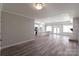 Open-concept living space with sleek floors, modern lighting, and a charming fireplace at 4531 Dry Run Rd, Fort Mill, SC 29708