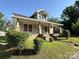 Charming home with a covered porch, brick base, and well-maintained landscaping at 462 Dave Lyle Blvd, Rock Hill, SC 29730