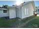 Exterior back corner view with white siding, green grass, and gravel area at 462 Dave Lyle Blvd, Rock Hill, SC 29730
