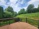 Lush backyard with a spacious deck, surrounded by mature trees and greenery, creating a serene outdoor space at 467 Granite Lake Ct, Denver, NC 28037
