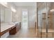 Bathroom with double vanity, tiled floor, and glass enclosed shower at 467 Granite Lake Ct, Denver, NC 28037