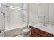 Well-lit bathroom featuring a bathtub and shower combination, toilet, and vanity with a large mirror at 467 Granite Lake Ct, Denver, NC 28037