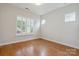 Bright, empty bedroom with hardwood floors, plantation shutters, and natural light at 467 Granite Lake Ct, Denver, NC 28037