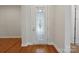 Welcoming foyer featuring a decorative glass door and gleaming hardwood floors at 467 Granite Lake Ct, Denver, NC 28037
