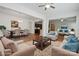 Open-concept living room featuring hardwood floors and seamless flow into the dining area and kitchen at 467 Granite Lake Ct, Denver, NC 28037