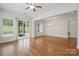 Bright and spacious living room with hardwood floors and an open layout for entertaining and relaxation at 467 Granite Lake Ct, Denver, NC 28037