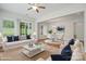 Cozy living room and dining area with hardwood floors, modern furnishings, and an open floor plan at 467 Granite Lake Ct, Denver, NC 28037