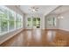 A spacious living room features hardwood floors, abundant natural light, and a sliding glass door to outdoor deck at 467 Granite Lake Ct, Denver, NC 28037