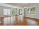 A spacious and naturally bright living room features beautiful hardwood flooring at 467 Granite Lake Ct, Denver, NC 28037
