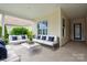Inviting covered patio with comfortable seating, stylish decor, and a relaxing outdoor ambiance at 467 Granite Lake Ct, Denver, NC 28037