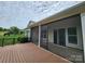 A screened porch with a wood-look deck presents an ideal space for enjoying the outdoors at 467 Granite Lake Ct, Denver, NC 28037