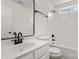 Bathroom features a white sink and toilet with modern black fixtures and a shower at 5529 Seths Dr, Charlotte, NC 28269