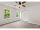 Bedroom featuring a ceiling fan, closet, and well-lit windows offering natural light at 5529 Seths Dr, Charlotte, NC 28269
