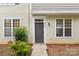 Inviting home front with stylish gray door, symmetrical windows, and manicured landscape at 5529 Seths Dr, Charlotte, NC 28269