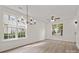 Bright, airy living room with ceiling fan, hardwood floors, and multiple windows at 5529 Seths Dr, Charlotte, NC 28269