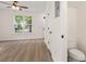 Spacious living room featuring hardwood floors and a view to an adjacent bathroom at 5529 Seths Dr, Charlotte, NC 28269