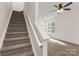 Inviting staircase leading to a bright living space with hardwood floors at 5529 Seths Dr, Charlotte, NC 28269