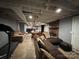 A basement with concrete floors, exposed beams, and two sofas at 616 E Oakwood Ave, Albemarle, NC 28001