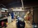 Basement with a motorcycle, work bench, and garage door at 616 E Oakwood Ave, Albemarle, NC 28001