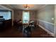 Comfortable dining room with modern lighting and window at 616 E Oakwood Ave, Albemarle, NC 28001