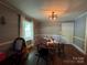 Cozy dining room with modern light fixture and window at 616 E Oakwood Ave, Albemarle, NC 28001