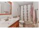 Cozy bathroom features a tub with shower and a light wood vanity at 625 Saint Andrews Rd, Statesville, NC 28625