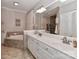Bathroom featuring tiled floors, a soaking tub, a double sink vanity, and bright lighting at 625 Saint Andrews Rd, Statesville, NC 28625