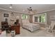 Bedroom with natural light, ceiling fan, and floral bedding at 625 Saint Andrews Rd, Statesville, NC 28625