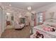 Bright bedroom featuring floral wallpaper, hardwood floors, and soft pastel accents at 625 Saint Andrews Rd, Statesville, NC 28625