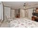 Bright bedroom with a ceiling fan, rocking chair, and plenty of closet space at 625 Saint Andrews Rd, Statesville, NC 28625