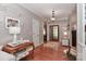 Inviting foyer with hardwood floors, stylish decor, and a view into other rooms at 625 Saint Andrews Rd, Statesville, NC 28625