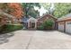 Charming brick home featuring a well-manicured yard and a welcoming front porch at 625 Saint Andrews Rd, Statesville, NC 28625