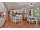 Well-lit kitchen featuring white cabinetry, granite countertops, and stainless steel appliances at 625 Saint Andrews Rd, Statesville, NC 28625