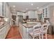 Spacious kitchen with white cabinets, granite countertops, and a breakfast nook at 625 Saint Andrews Rd, Statesville, NC 28625