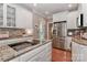 Gourmet kitchen with stainless steel appliances, granite countertops and white cabinetry at 625 Saint Andrews Rd, Statesville, NC 28625