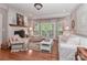Cozy living room with a brick fireplace, French doors, and comfortable seating at 625 Saint Andrews Rd, Statesville, NC 28625