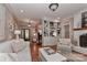 Bright and airy living room featuring a fireplace, built-ins, and hardwood floors at 625 Saint Andrews Rd, Statesville, NC 28625